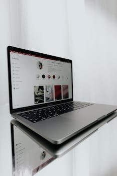 Open Laptop Reflecting in a Table